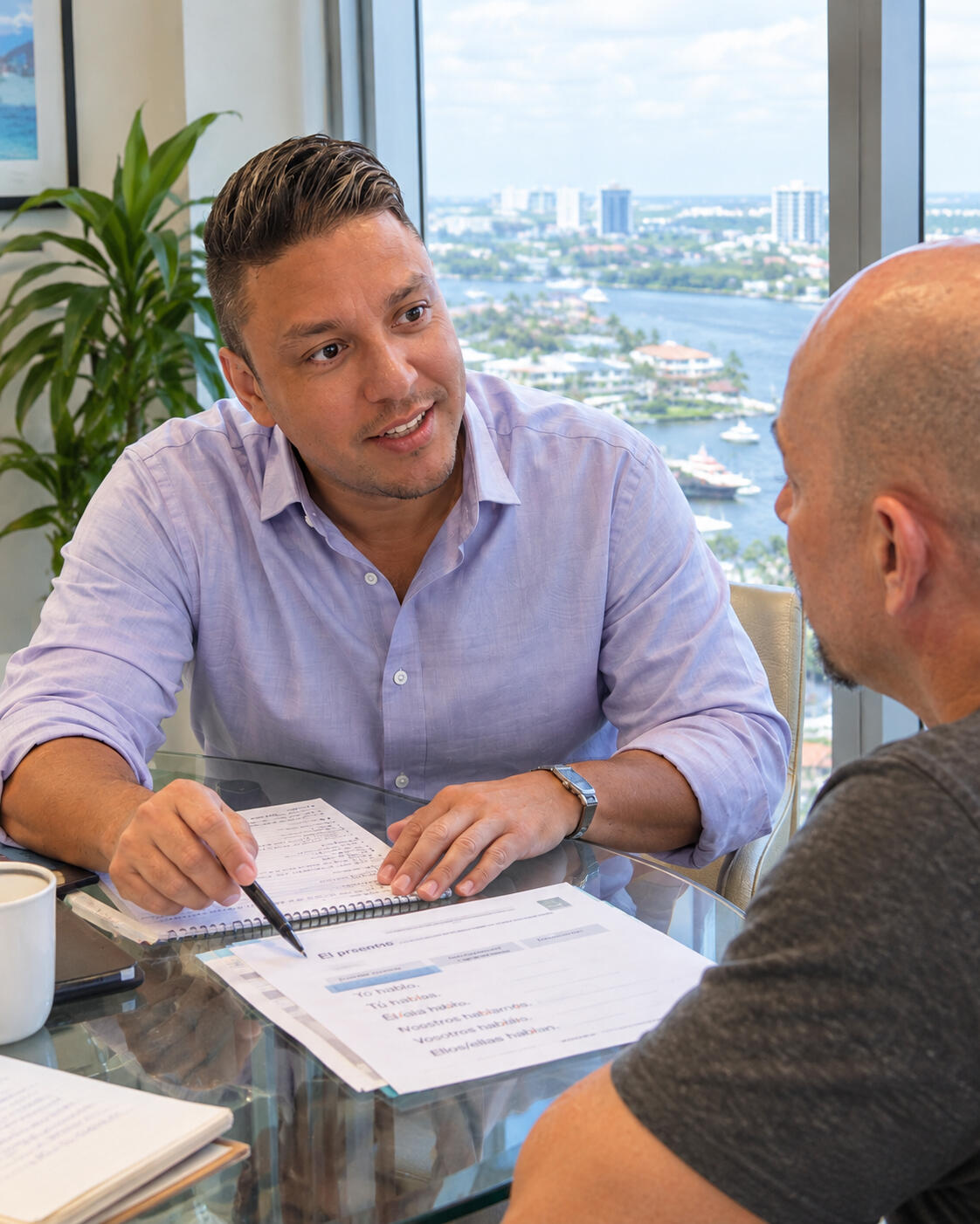 Spanish tutor Rodney Moya explaining Spanish to an adult student